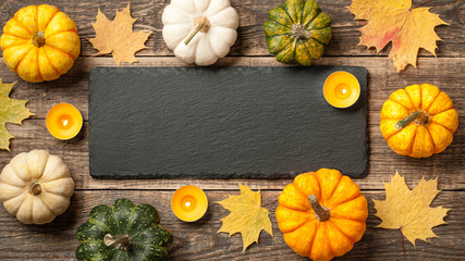 Poster - Thanksgiving background with pumpkins, autumn leaves and candles