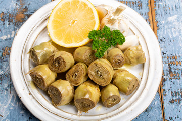 Wall Mural - Marinated artichokes with garlic, lemon and olive oil