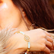 © marbenzu - Fashionable boho yoga mineral stone bracelet on female wrist