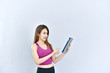 © Wutthichai - Woman holding exercise pad
