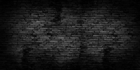 Black brick walls that are not plastered background and texture. The texture of the brick is black. Background of empty brick basement wall.