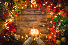 Christmas Composition. Gifts, Fir Tree Branches, Decorations On A Wooden Background With Copy Space For Your Text. Christmas, Winter New Year Concept. Led Lights