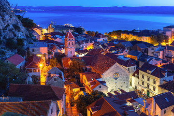 Wall Mural - Red roofs of Old town and Church of St Michaelat night, Omis, popular tourist spot in Croatia