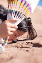 Modern Traditional Navajo Woman In New Mexico. Pow Wow  Celebration Kissing The Ground. Red Canyon In New Mexico