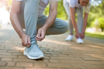 Tying shoelaces before running stock photo