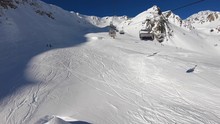 Tonale, Ponte Di Legno, Italy. Hyperlapse Chairlift With Skiers Moving To The Top Of The Mountain In A Wonderful Sunny Day