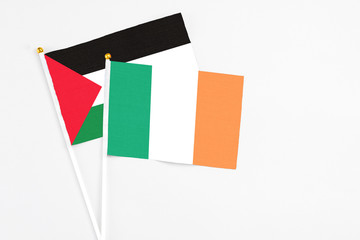 Canvas Print - Ireland and Palestine stick flags on white background. High quality fabric, miniature national flag. Peaceful global concept.White floor for copy space.