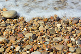 Fototapeta Desenie - Background of marine pebbles smoothed by sea water.