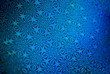 © PeskyMonkey - Festive full frame background of shiny blue star patterns