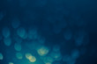 © Shubby Studio - dark blue Festive Christmas Beautiful abstract Background with bokeh lights. Holiday Texture with copy space. Can be used as Wallpaper, filling for a website, defocused
