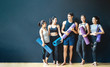 © Kawee - Group of diversity ethnic people holding Yoga mat talking together with smile. Asian girl laughing with funny face after finish training class. Happy and relax time in group of best friend in Gym.
