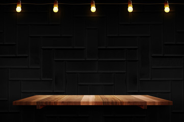 Poster - Empty brown plank wood shelf at black modern tile wall background with light bulbs string,Mockup for display or montage of product or design.