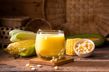 Fresh Sweet Corn Juice (corn Milk) And Corn On Wood Background