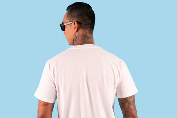 Wall Mural - A man wearing white t shirt in back side view isolated on background. Hipster man with tattoo wearing white long sleeve t shirt, ready for your mock up template or background