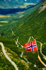 Wall Mural - Norwegian flag and Trollstigen mountain road