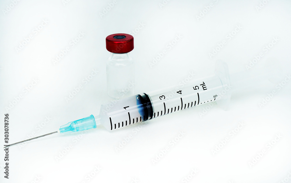 Red Injectable Liquid Disposable syringe and red liquid in injection vial, Vials with ...
