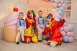 Circus clowns at the birthday party. Little brothers and clowns. Party for children.