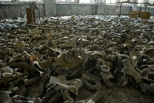 Gas Masks On The Floor With An Old Television In An Abandoned Middle School In Pripyat