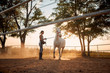 © luckybusiness - Young woman training her horse