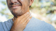 Sick man suffering from sore throat Causes of throat pain include flu, common cold