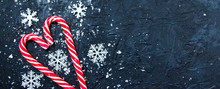 Christmas Banner Composition. Candy With Snow On Dark Blue Background. Winter, New Year Concept. Flat Lay, Top View, Copy Space