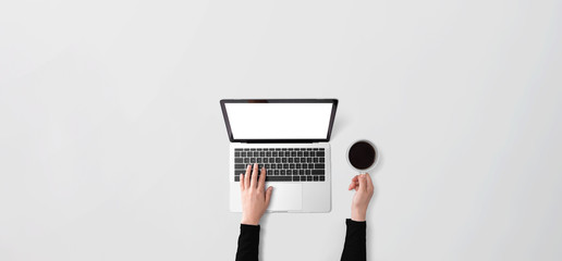 Person using a laptop computer from above