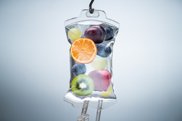 Wall Mural - Different Fruit Slices Inside Saline Bag Hanging In Hospital