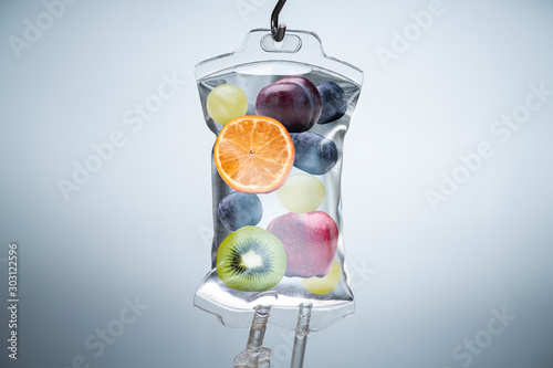 Fotomural Different Fruit Slices Inside Saline Bag Hanging In Hospital