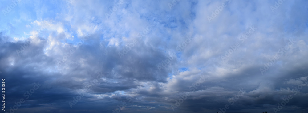 Big summer clouds. Atmospheric phenomenon - the vapor state of water. Panoramic photo - obrazy, fototapety, plakaty 