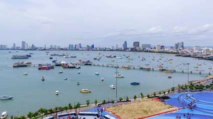 Wall Mural - Time-lapse: Pattaya bay and Bali Hai Pier, with ferry to Ko Lan (Coral Island) Chonburi, Thailand; tilt up.