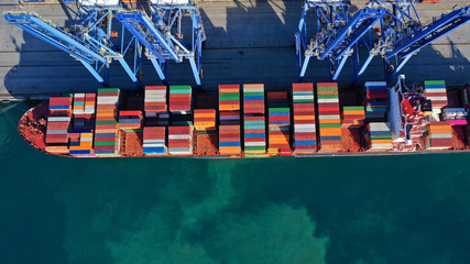 Aerial top down photo of industrial cargo container logistics terminal