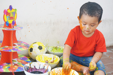 Asian boys one year and three months playing color mixing activities artist concept.