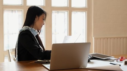 Wall Mural - Business woman accountant or banker using calculator in retro office. Savings, finances and economy concept.