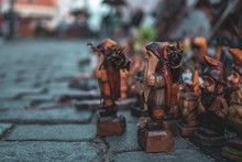 Many Wooden And Traditional Figurines Of Gnomes On Main Market Square In Wroclaw, Poland