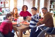 © Krakenimages.com - Beautiful family smiling happy and confident. Eating roasted turkey make selfie by smartphone celebrating christmas at home