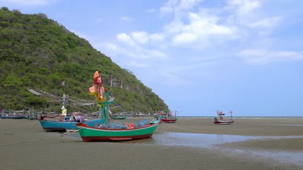 Wall Mural - Fishing boat on beach near fisherman village at Khao Kalok mountain, near Hua Hin, Thailand