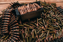 Different Ammo On Wooden Background.