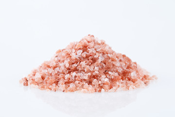 Pink himalayan salt isolated on white background.