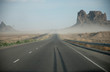 Straight road with sand storm in USA