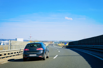 Sticker - Car road curve on background for concept design. Automobile Motion line. Urban transport. Outdoor. Adventure travel. Modern town. Beautiful landscape. Vacation, summer. Highway traffic in Slovenia