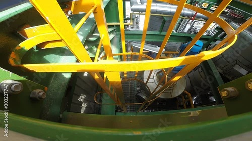 Fotografía Operation engineer is climbing a vertical ladder inside a petroleum plant