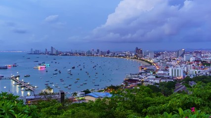 Wall Mural - Time Lapse: Pattaya bay and Bali Hai Pier, from Phra Tamnak Mountain viewpoint, day to night, Chonburi, Thailand; pan left