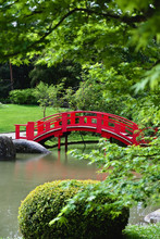 Red Bridge Of The Japanese Garden Of Pierre-Baudis In Toulouse, France