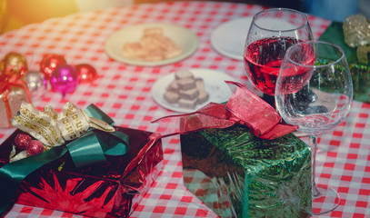 Group of friends to enjoy Christmas party filled with gift boxes a variety of colors and food. They celebrated until the morning in the living room.