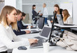© JackF - employees work on laptops in office