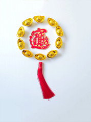 Wall Mural - Chinese New Year ingots flat lay series on white background. Middle Chinese word 