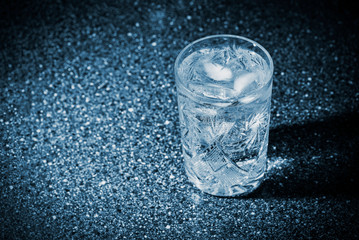 Glass of sparkling water with ice