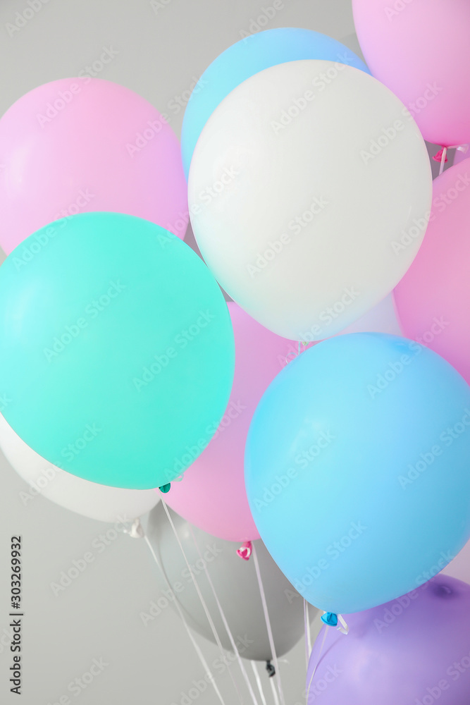 Air balloons on light background, closeup