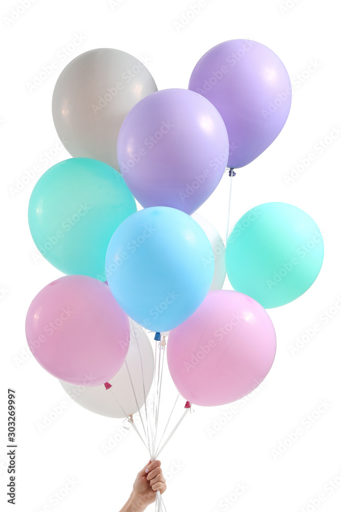 Female hand with balloons on white background