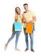 © Pixel-Shot - Young couple with credit cards and shopping bags on white background